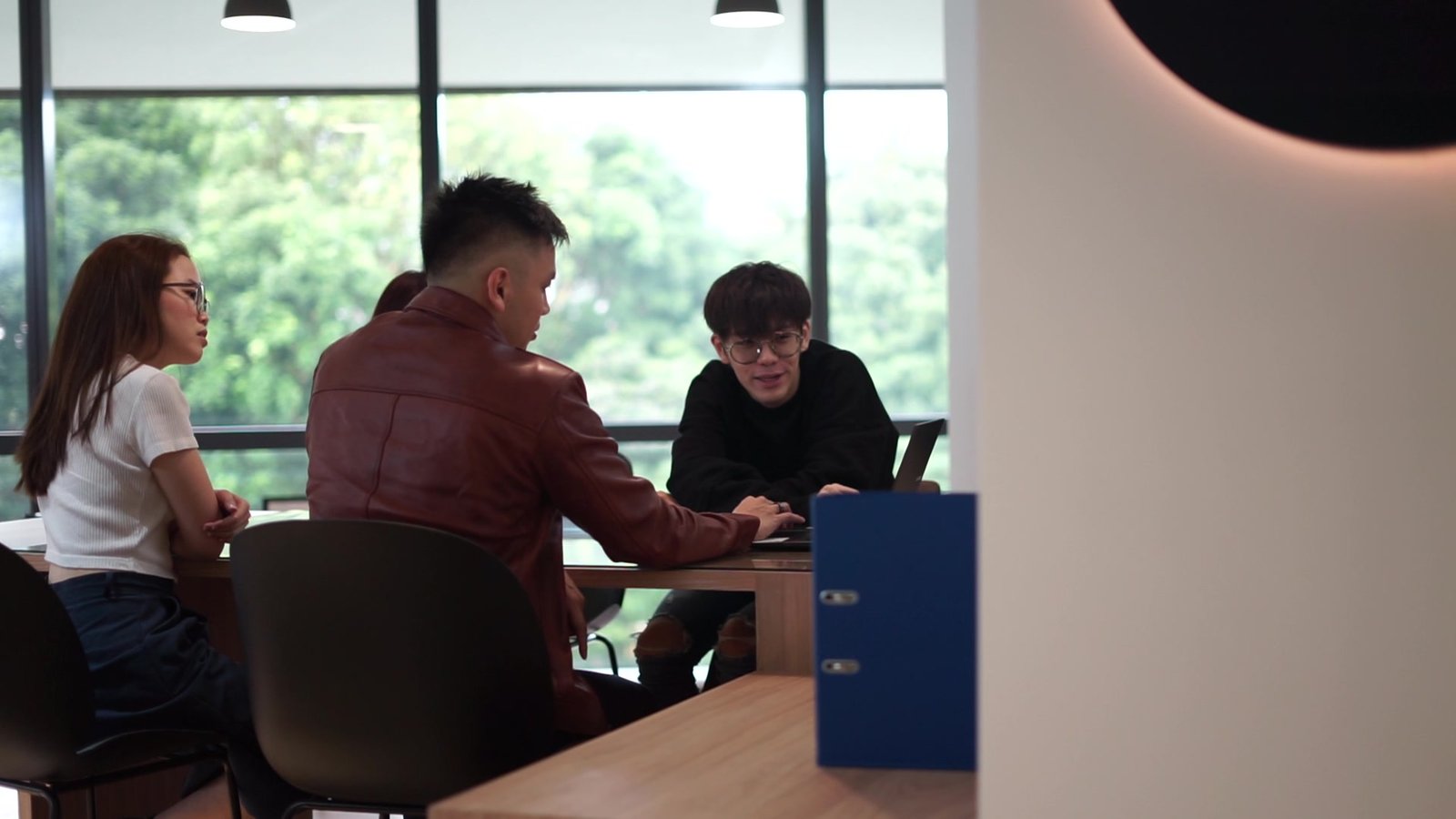 The team in a strategy meeting at the Woodlands office